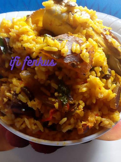 A picture of Palm oil native jollof rice.