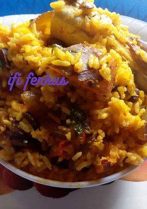 A picture of Palm oil native jollof rice.