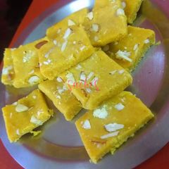A picture of Besan burfi with condensed milk.