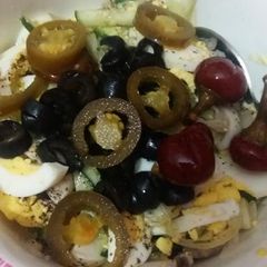 A picture of Egg and vegetable salad.