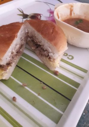 A picture of Keema burger with chilli tomato paste.