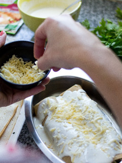 Una foto de Receta de Canelones de ternera deshilachada, queso pategrás y espinaca