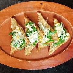 A picture of Corn spinach open sandwich.