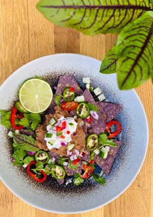A picture of Green Herb Vegan Nachos 🌿 🌱🌶.