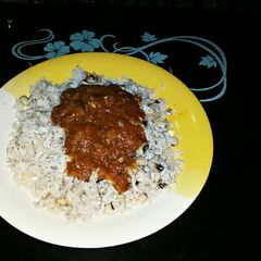 Rice and beans with stew A picture of Rice and beans with stew.