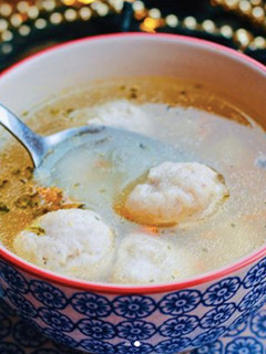 A picture of Soup with chicken meatballs.