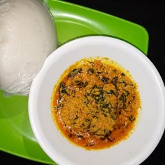 A picture of Tuwon shinkafa and egusi soup.