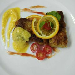 A picture of Pan fried chicken with Maltaise sauce.