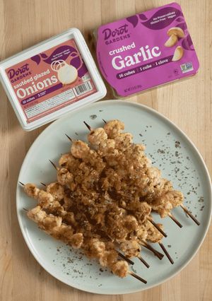 A picture of Garlic Shrimp Skewers with Glazed Onions.