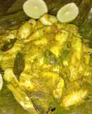 Steamed small fish in banana leaves