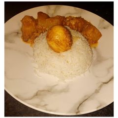 A picture of Egg curry with bell peppers.