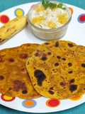 Dashmi -- Milk Based Flatbread With Sweet Elaichi Kela & Sev Raita