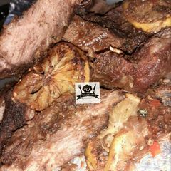 A picture of Oven and coal grilled meat.