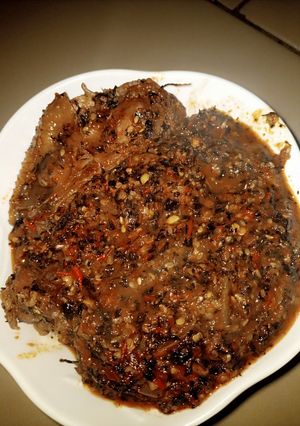 A picture of Bitter leaf soup with seseme seeds.
