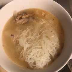 A picture of Turkey bone broth with rice noodles.