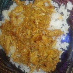 Bourbon Chicken over white rice A picture of Bourbon Chicken over white rice.