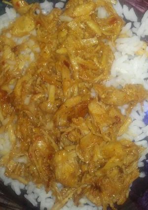 A picture of Bourbon Chicken over white rice.