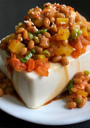 A picture of Cold Tofu with ‘Nattō’, ‘Takuan’ & Kimchi.