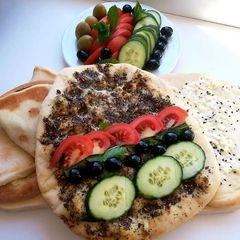 A picture of Lebanese_flat_bread_with_cheese_or_zaatar#Manoushe.