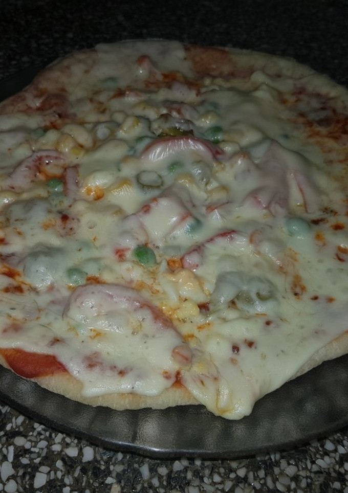 Una foto de Pizza Completa en la parrilla de la Estufa 🍕🔥