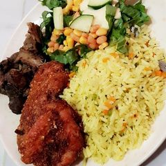 A picture of Jallop rice garnish with corn salad.