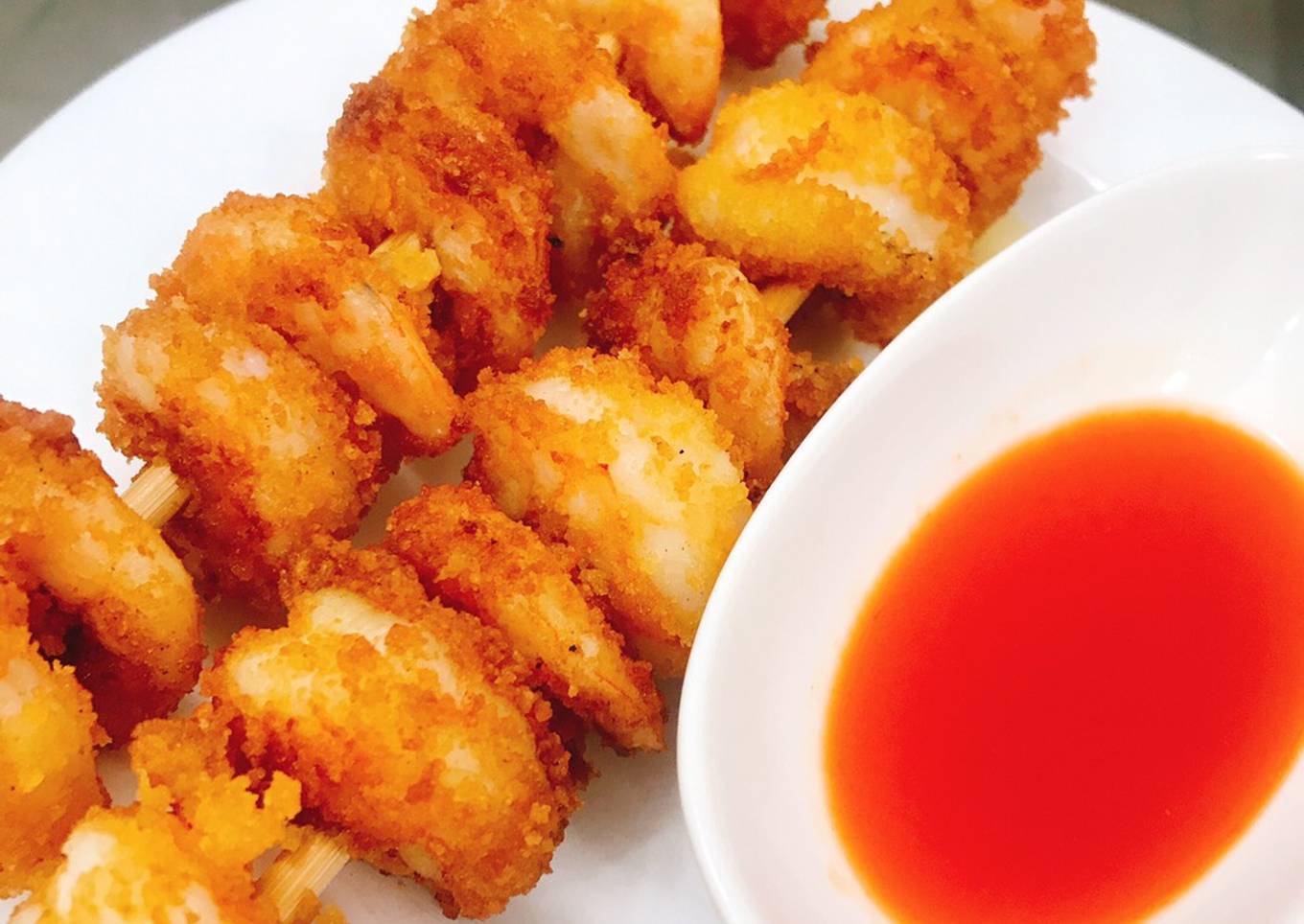 Fried shrimp in breadcrumbs and spicy Abuja sauce