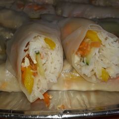 A picture of Vietnamese spring rolls and spicy dip.