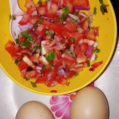 A picture of Boilled egg with kachumbari #jikonichallenge.