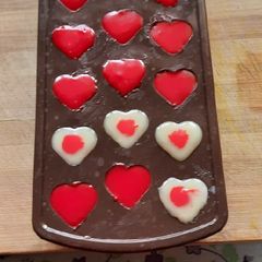 A picture of Morde white compound heart shape red chocolate.