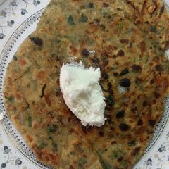 A picture of Mushroom onion tomato paratha.