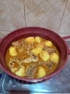 A picture of Marinated chicken stew with potatoes.