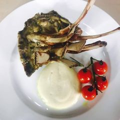A picture of Lamb Rack on a bed of cauliflower puree.