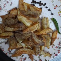 A picture of Deep fry potatoes with black pepper.