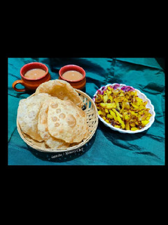 A picture of Poori aloo bhaji (Poori aloo fry).