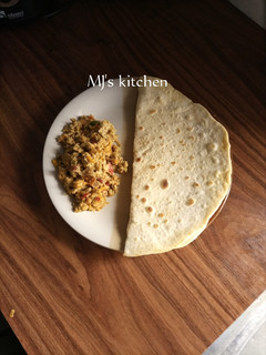 A picture of Flat bread with carrot egg sauce.