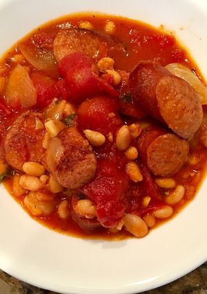 A picture of Andouille Sausage with White Beans in Tomato Sauce.