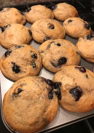 A picture of Blueberry muffins with Greek yogurt and honey.