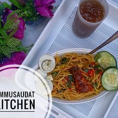 Pasta jollof with tamarind juice A picture of Pasta jollof with tamarind juice.