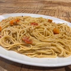 A picture of Mascarpone, tomato and walnuts spaghetti.