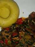 Pounded unripe plantain with assorted meat and vegetable soup