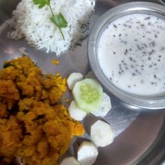 A picture of Pithlu(Besan) Rice and Chaas.