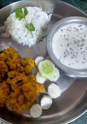 A picture of Pithlu(Besan) Rice and Chaas.