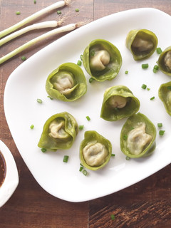 A picture of Spinach and Cottage Cheese Momos with Honey Chilli dip.