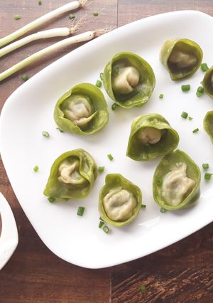 A picture of Spinach and Cottage Cheese Momos with Honey Chilli dip.