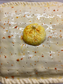 Una foto de Empanada de Mandarina en almíbar-Bacon-Queso y toque de jengibre
