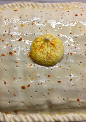 Una foto de Empanada de Mandarina en almíbar-Bacon-Queso y toque de jengibre