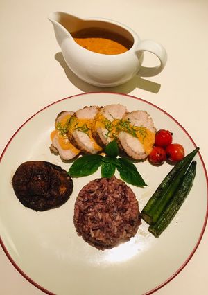 A picture of Roasted Pork Loin with Panang Sauce.