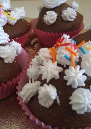 A picture of BlackForest Muffins With Whipping Cream.