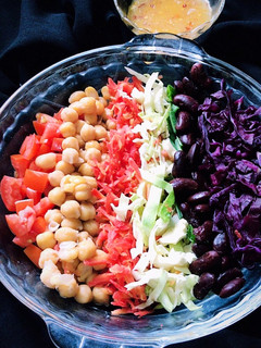 A picture of Rainbow salad with lemon and olive oil dressing.