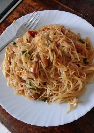 A picture of Leftover chicken with spaghetti.